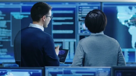 In the System Control Room IT Specialist and Project Engineer Have Discussion. 스톡 동영상 80982358