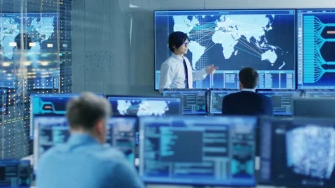 In the System Control Room Manager Holds a Briefing for His Staff Members. Stock Footage 80986259