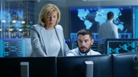 In the System Control Room Senior Technical Supervisor Observes Work. Stock Footage 81694311