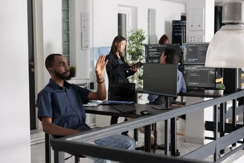 System engineer looking at ar hologram to work on data script Stock Photos
