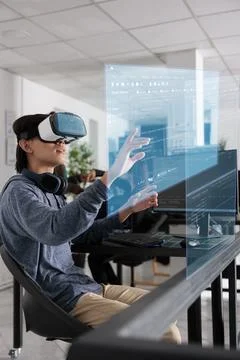 System engineer writing html code and using holographic program Stock Photos