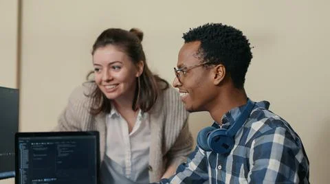 System engineers celebrating successful code compiling doing high five hand Stock Photos