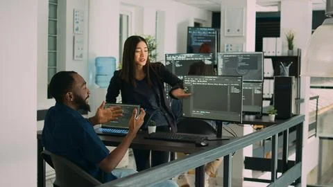 System engineers celebrating successful code compiling Stock Photos