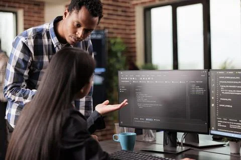 System engineers using binary code to script security system Stock Photos