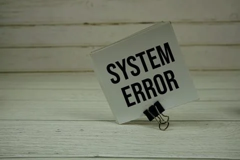 System Error text message write on sticky note on wooden background Stock Photos