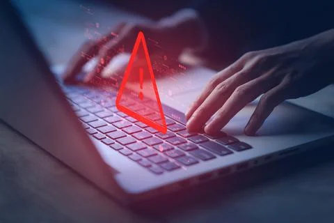 System hacked warning alert on notebook (Laptop). Cyber attack on computer .. Stock Photos