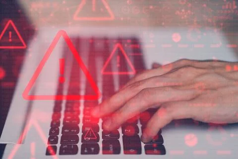 System hacked warning alert on notebook (Laptop). Cyber attack on computer .. Stock Photos