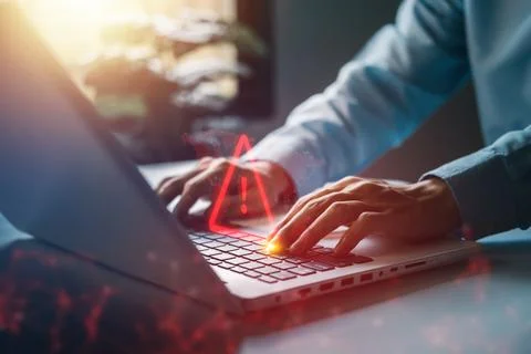 System hacked warning alert on notebook (Laptop). Cyber attack on computer .. Stock Photos