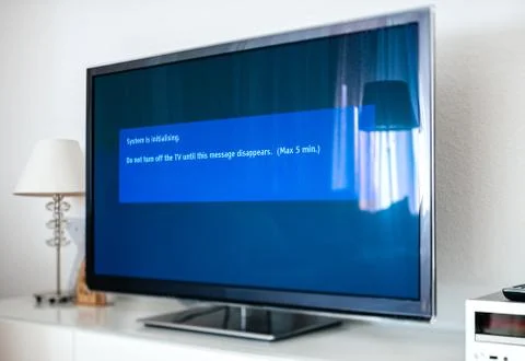 System is initializing on modern tv update process 스톡 사진