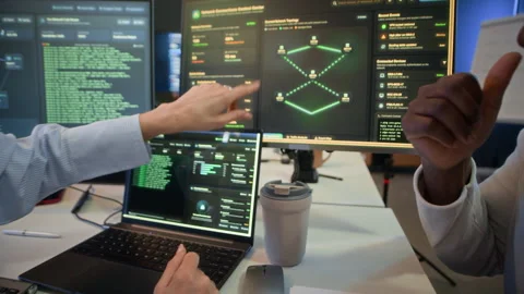System Managers Analyzing Network Data on Computer in Office Stock Footage 334935855