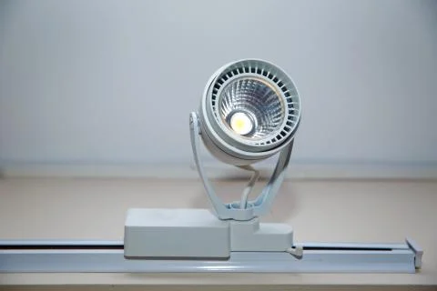 The system runs suspended from the ceiling on the rail. The head of the spotl Stock Photos