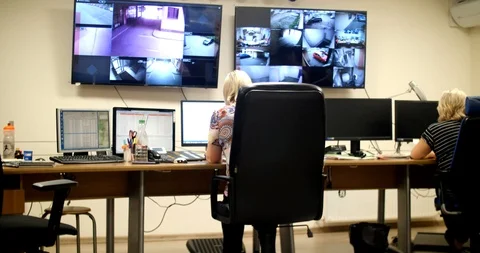 System Security Specialist Working at System Control Center. Room is Full of Stock Footage 102383135