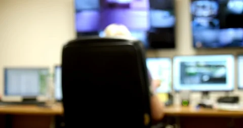 System Security Specialist Working at System Control Center. Room is Full of Stock Footage 102383170