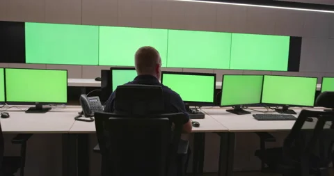 System Security Specialist Working at System Control Center. Room is Full of Stock Footage 151456048