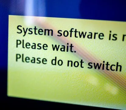 System software installing - please wait message on tv screen 写真素材