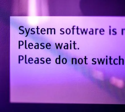 System software installing - please wait message on tv screen 写真素材