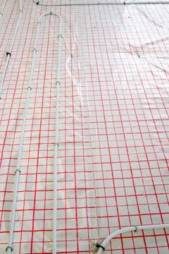System of underfloor heating, work in progress on a construction site for a flat Stock Photos