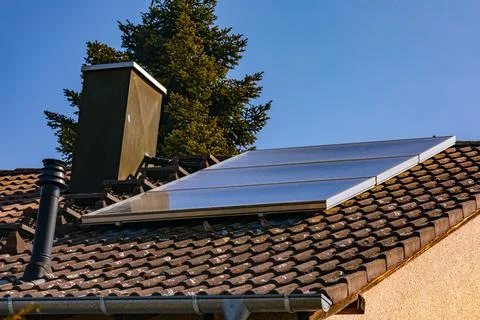 System for water heating with solar modules for a house in Germany Stock Photos