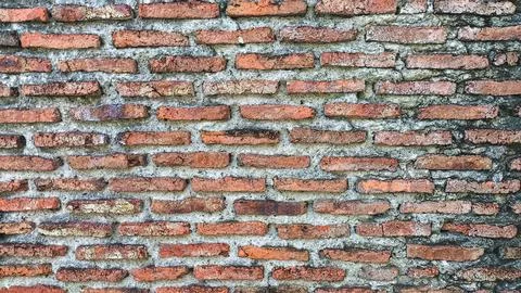 T Aged red brick wall with textured surface and visible mortar. Includes cl.. Stock Photos