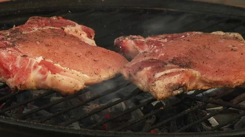 T-Bone Grilled Steak Being Flame Grilled on a Barbecue Stock Footage 40250447