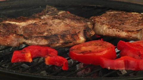 T-Bone Grilled Steak Being Flame Grilled on a Barbecue Stock Footage 40250494