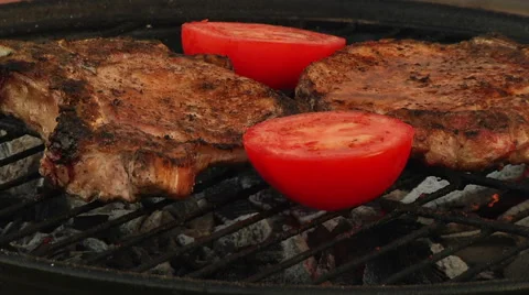 T-Bone Grilled Steak Being Flame Grilled on a Barbecue Stock Footage 40250512