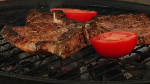 T-Bone Grilled Steak Being Flame Grilled on a Barbecue Stock-Footage 40256834