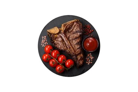 T-bone steak, beef meat grilled until done rare with salt and spices. T-bone  Stock Photos