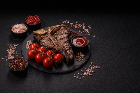 T-bone steak, beef meat grilled until done rare with salt and spices. T-bon.. Stock Photos