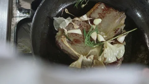 T bone steak fried with butter and garlic Stock Footage 72275836