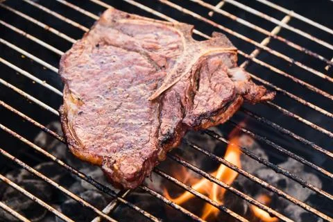 T-Bone Steak on a Grill Stock Photos
