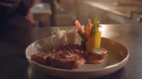 T-Bone steak meat meal adorned with flowers by restaurant chef Video stock 99397942
