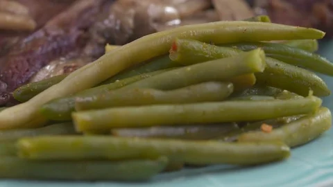 A T-Bone steak spins in slow motion. Stock Footage 72543806