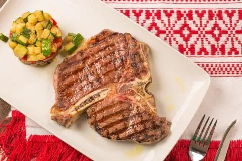 T bone steak with vegetables Stock Photos
