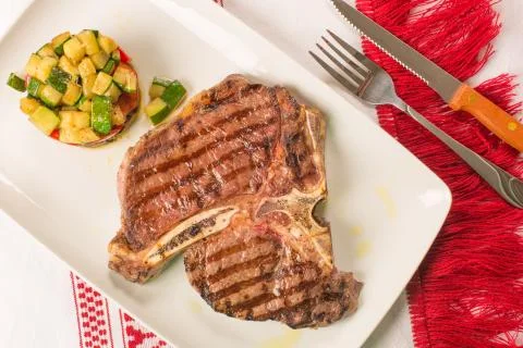 T bone steak with vegetables Stock Photos