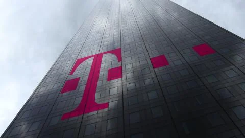 T-Mobile logo on a skyscraper facade reflecting clouds. Editorial 3D rendering Stock Illustration