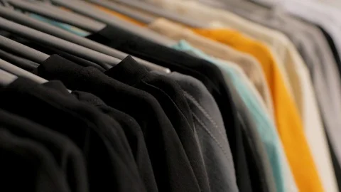T-shirts on a hanger Stock Footage 103689256
