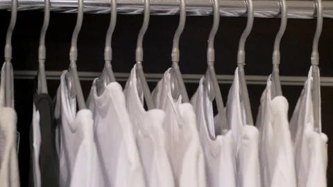 T-shirts on a hanger Stock Footage 103689286