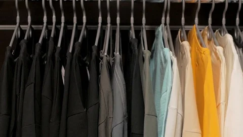 T-shirts on a hanger Stockbeeldmateriaal 103689311