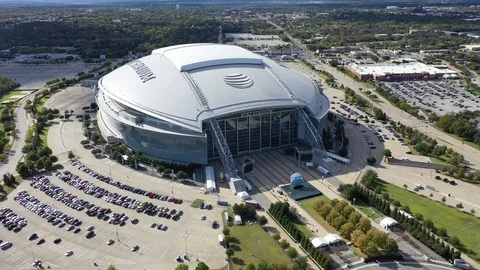 AT&amp;T Stadium seen above the surrounding Arlington parking Vidéo 97729156