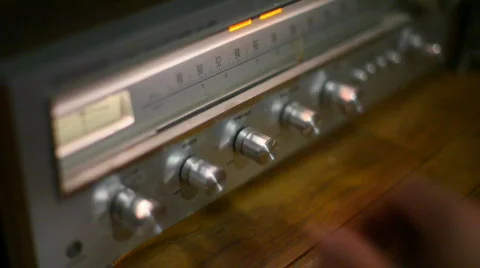 T150 turning knobs on radio Stock Footage