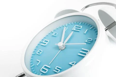 Table alarm clock with time 5 to 12 with blue clock face, 11.55 AM PM, on whi Foto stock
