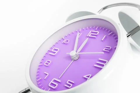 Table alarm clock with time 5 to 12 with purple clock face, 11.55 AM PM, on w Stock Photos