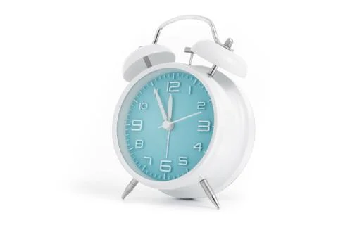 Table alarm clock with time 5 to 12 with blue clock face, 11.55 AM PM, on whi Stock Photos