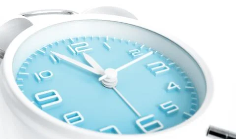 Table alarm clock with time 5 to 12 with blue clock face, 11.55 AM PM, on whi Stock Photos