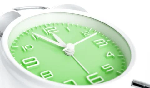 Table alarm clock with time 5 to 12 with green clock face, 11.55 AM PM, on wh Stock Photos