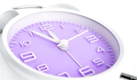 Table alarm clock with time 5 to 12 with purple clock face, 11.55 AM PM, on w Foto stock