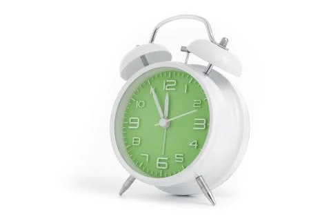 Table alarm clock with time 5 to 12 with green clock face, 11.55 AM PM, on wh Stock Photos