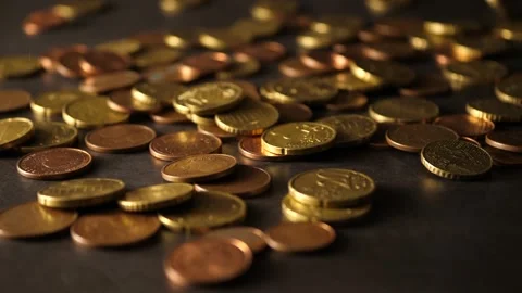 The table is already covered with coins when a rain of new coins begins Stock Footage 160556884