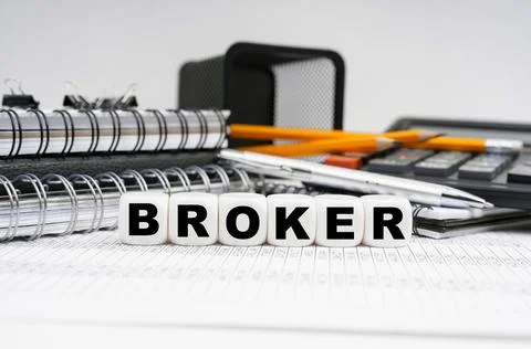 On the table, among office objects, cubes with the inscription - Stock Photos